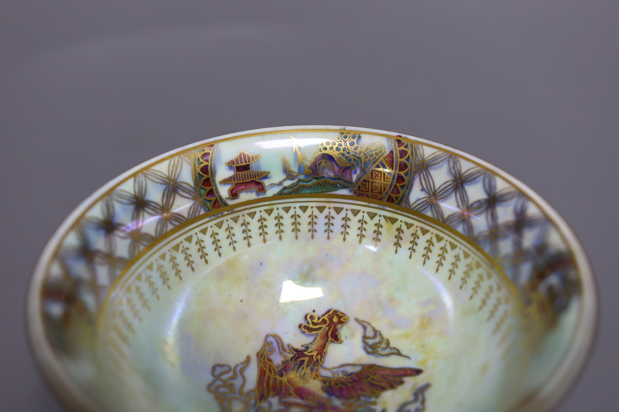 A Wedgwood blue lustre chinoiserie pedestal bowl, designed by Daisy Makeig Jones, pattern number Z4829, 8 cms high